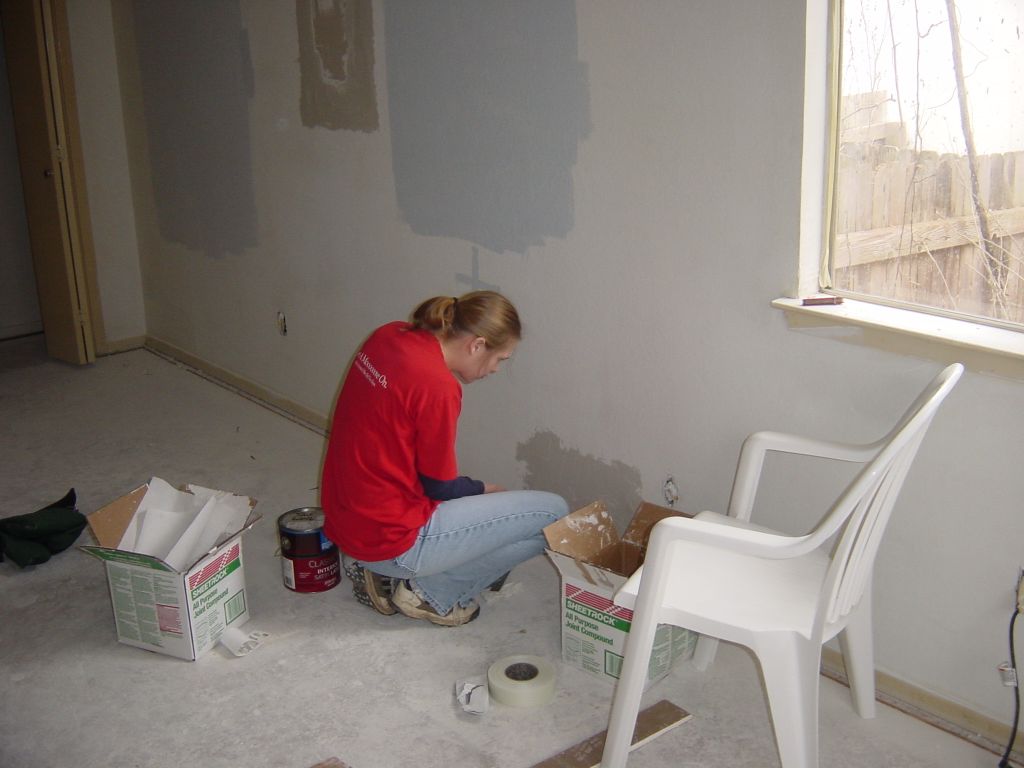 
Shelley is fixing holes in the drywall
