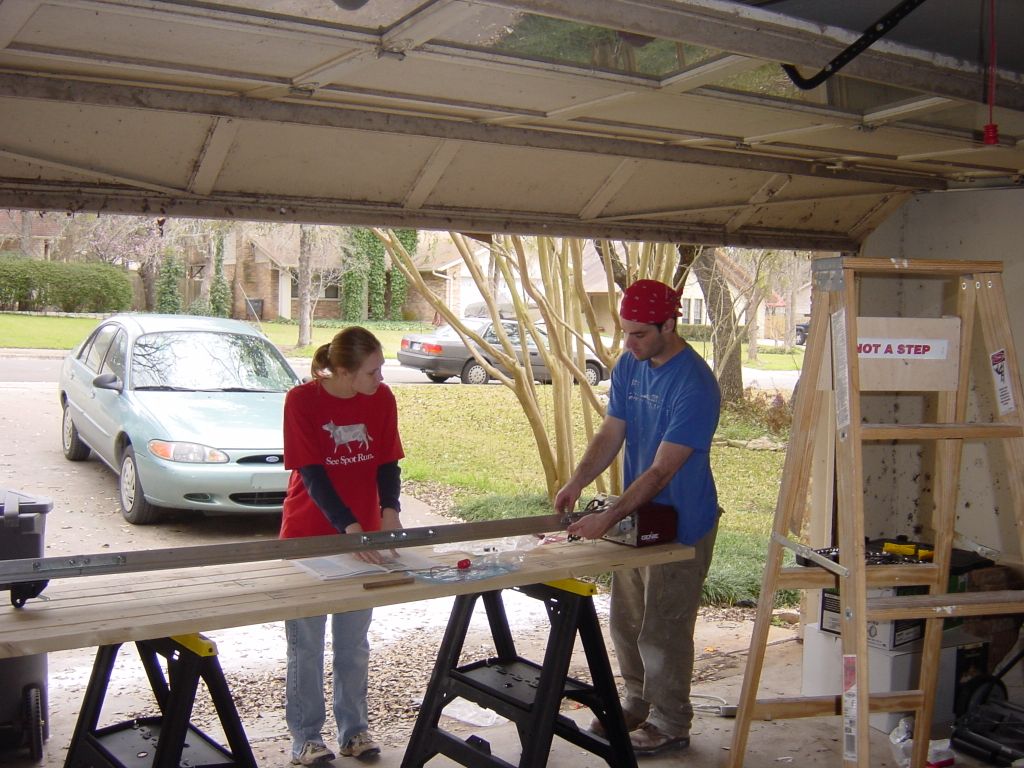 
Evanda and Shelley assembling the new garage door opener, before we realized the existing one worked
