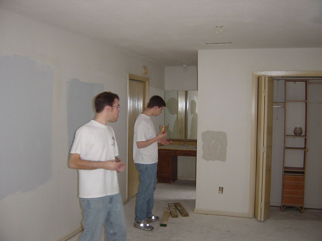 
Peter and Matt inspect the drywall over a doughnut
