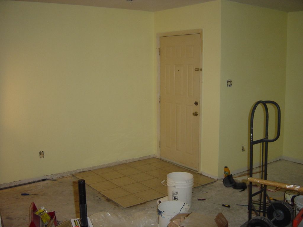 
Tile is finished in the Living Room, in front of the front door.
