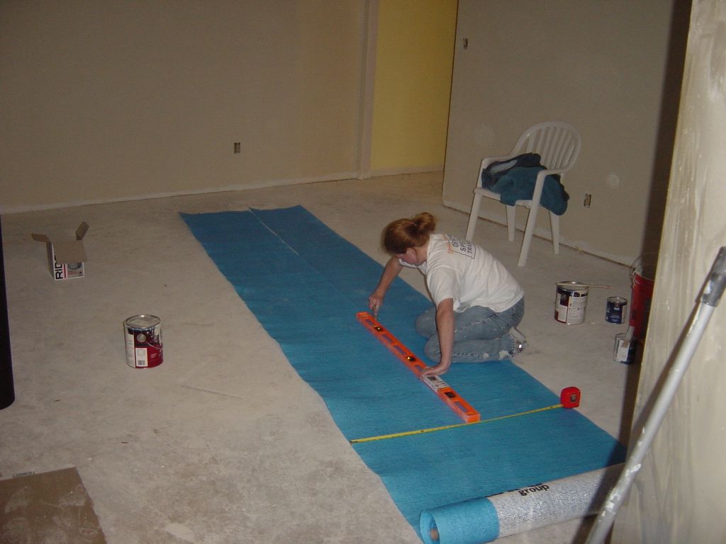 
Kara carefully cuts Kahrs cushioning.
