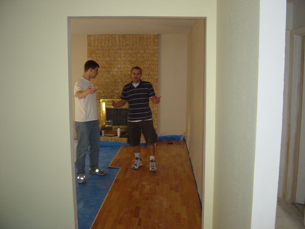 
Rick and Matt are holding a big piece of glass.  Okay, okay.  You're right.
They're really not holding a piece of glass.  But their mime routine is
improving, isn't it?  
