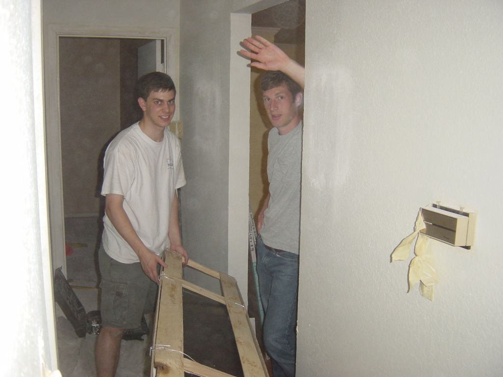 
Matt and his friend Aaron helping to move in the new bathtub.  The new bathtub
is a nice, new, real porcelain-on-cast-iron tub.  It weighs somewhere between
300 and 350lb.

