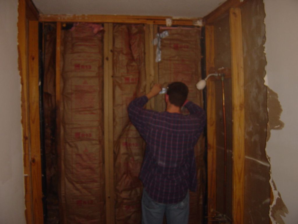 
The insulation was just a bit too narrow to fit between the studs on the 
right side, and we were getting a bit frustrated.  Fortunately, duct tape
came to the rescue.
