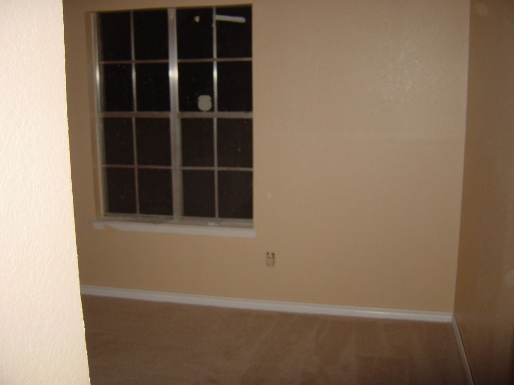 
This is the front bedroom with carpet and baseboards

