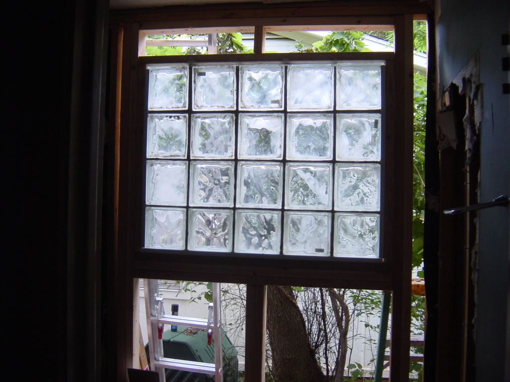 
Window installed!  It looks nice, but it dissolved my fingers.  Wear gloves when doing mortar work!
