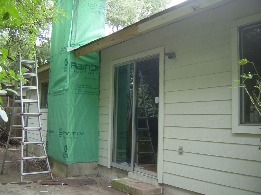 
New siding on most of the back wall.  
